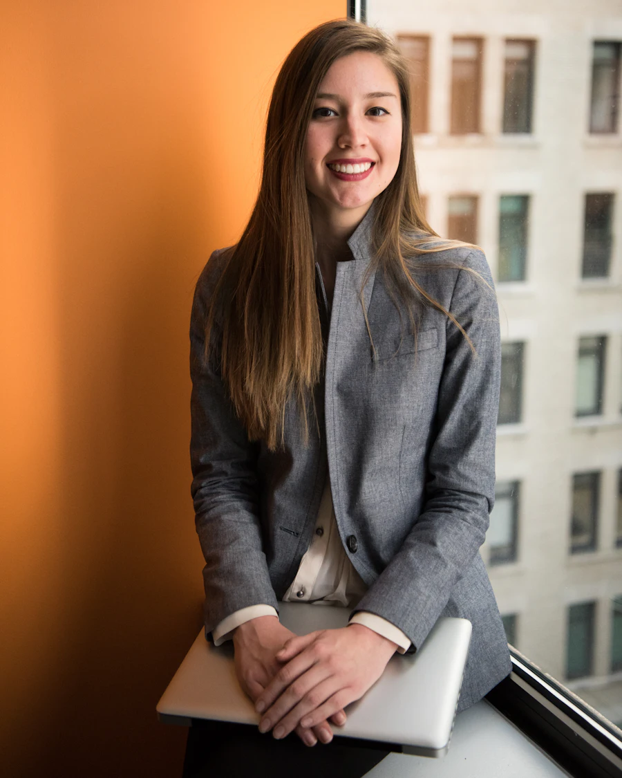The studio's founder smiling in the office