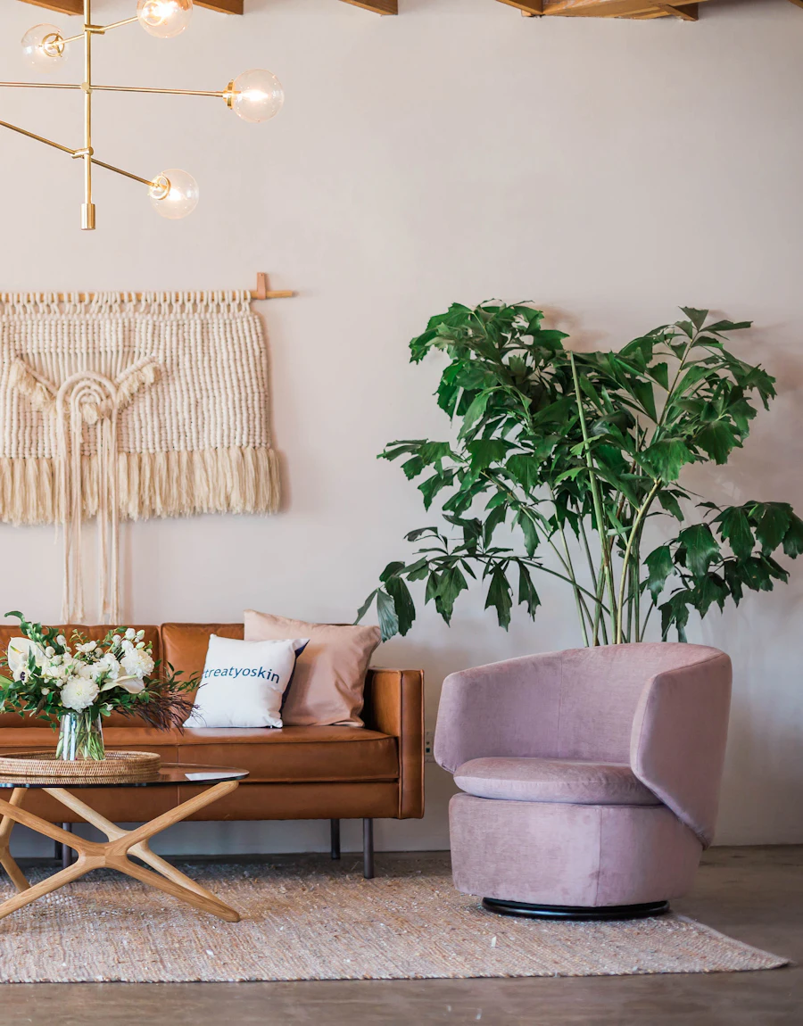 A warm living room with a rattan wall hanging